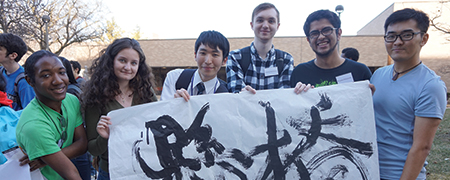 Wayne state students holding a banner